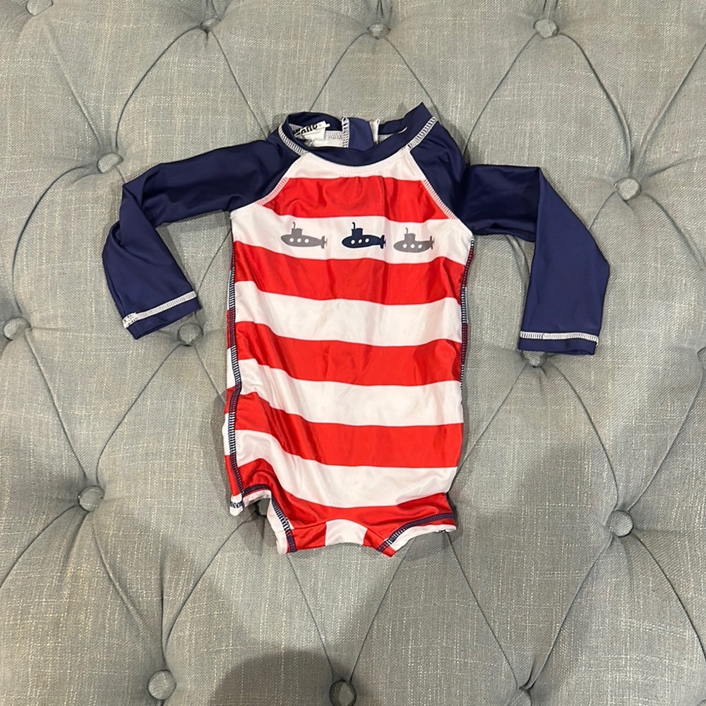 Red and White Striped Rashguard Swimwear with Nautical Motif